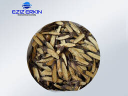 Корни и корневища солодки, резанные мелкими кусочками.